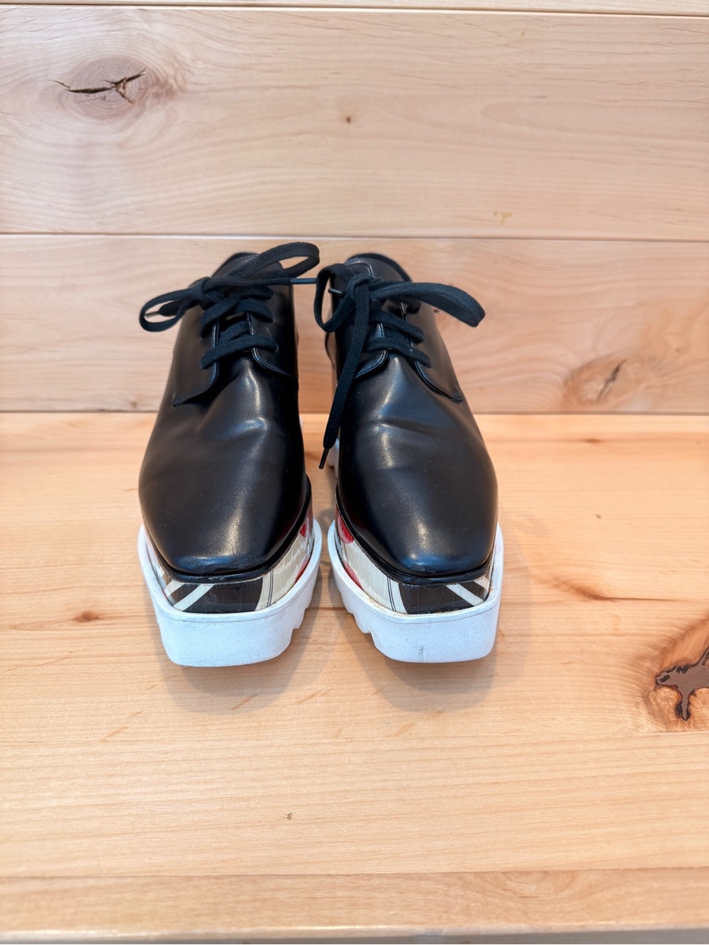 Stella McCartney Black Leather Elyse Platform Shoes with abstract design.